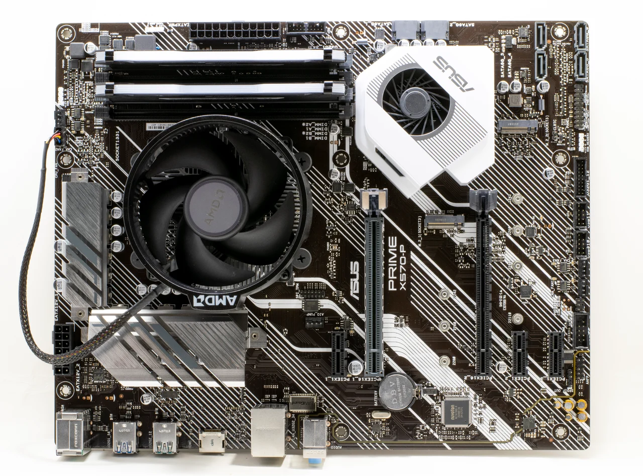 ASUS PRIME X570-P with an installed AMD cooler; rear I/O is at the bottom.